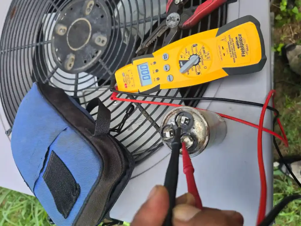 E-MAX HVAC technician performing a comprehensive AC tune-up and inspection in San Antonio, TX